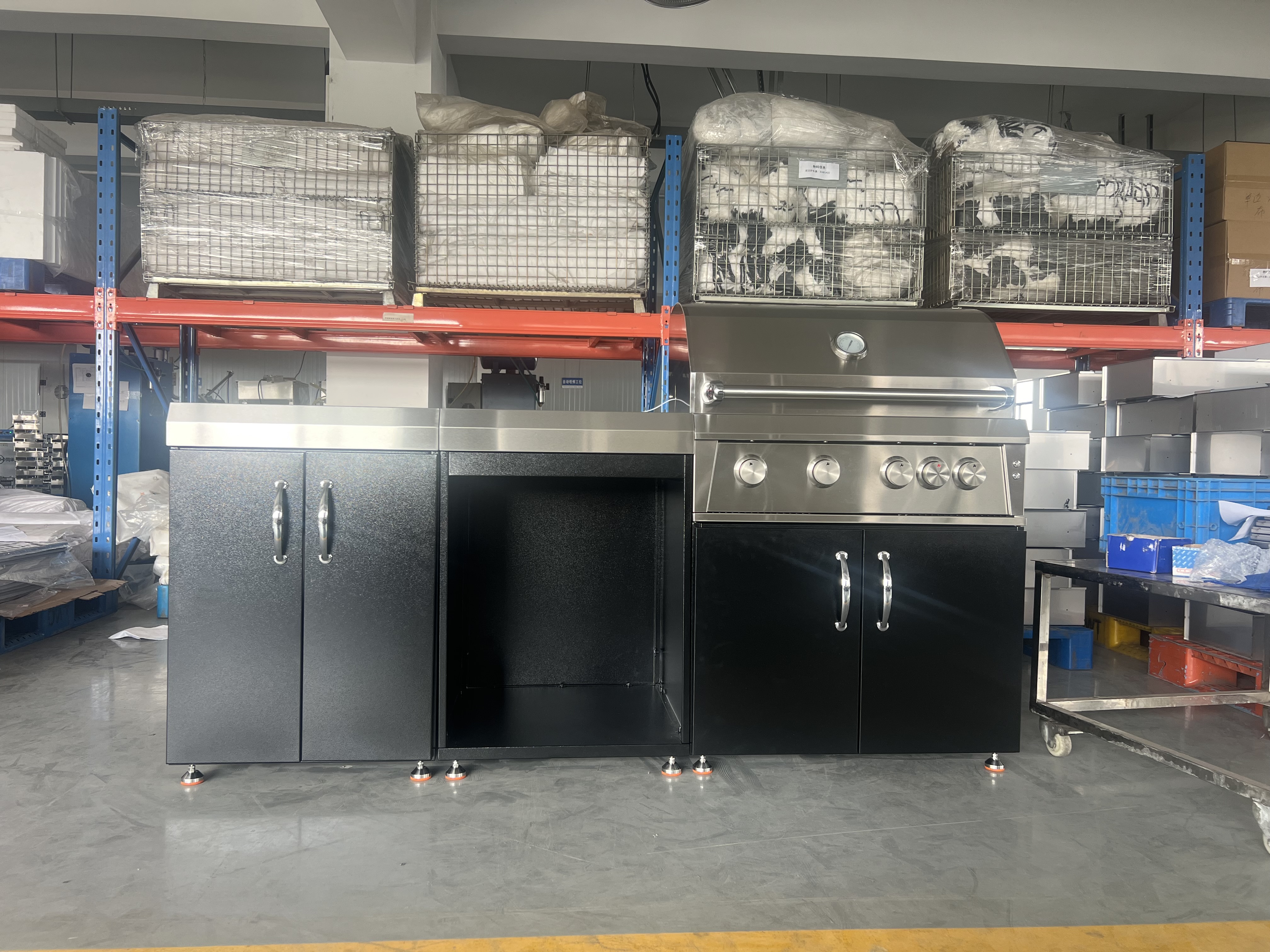 Three-module black outdoor kitchen with 201 stainless steel, powder coated, including a sink, refrigerator, and grill.